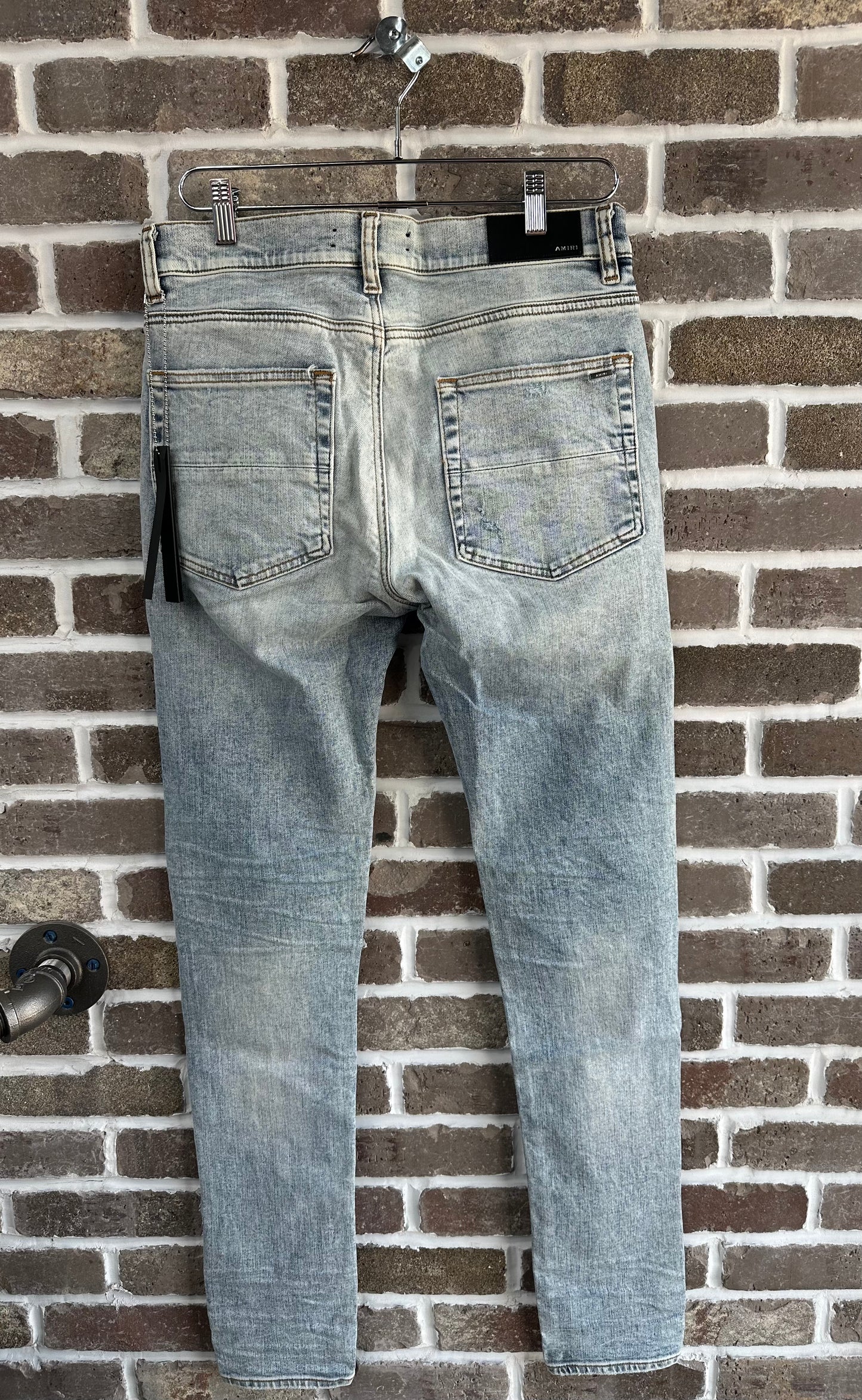 Amiri MX1 Light Wash Black Patch Jeans