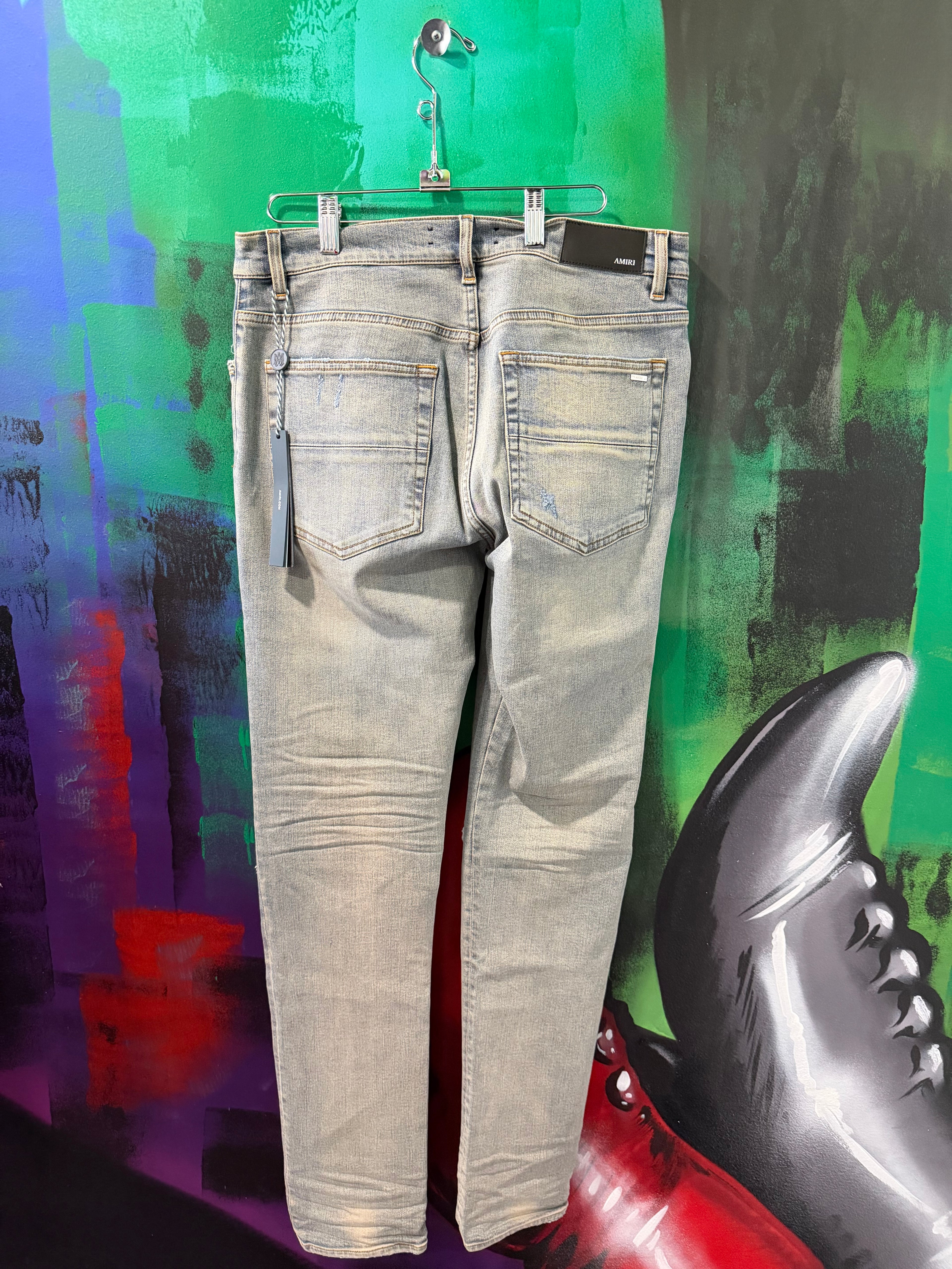 Amiri MX1 Light Wash & White Patch Jeans
