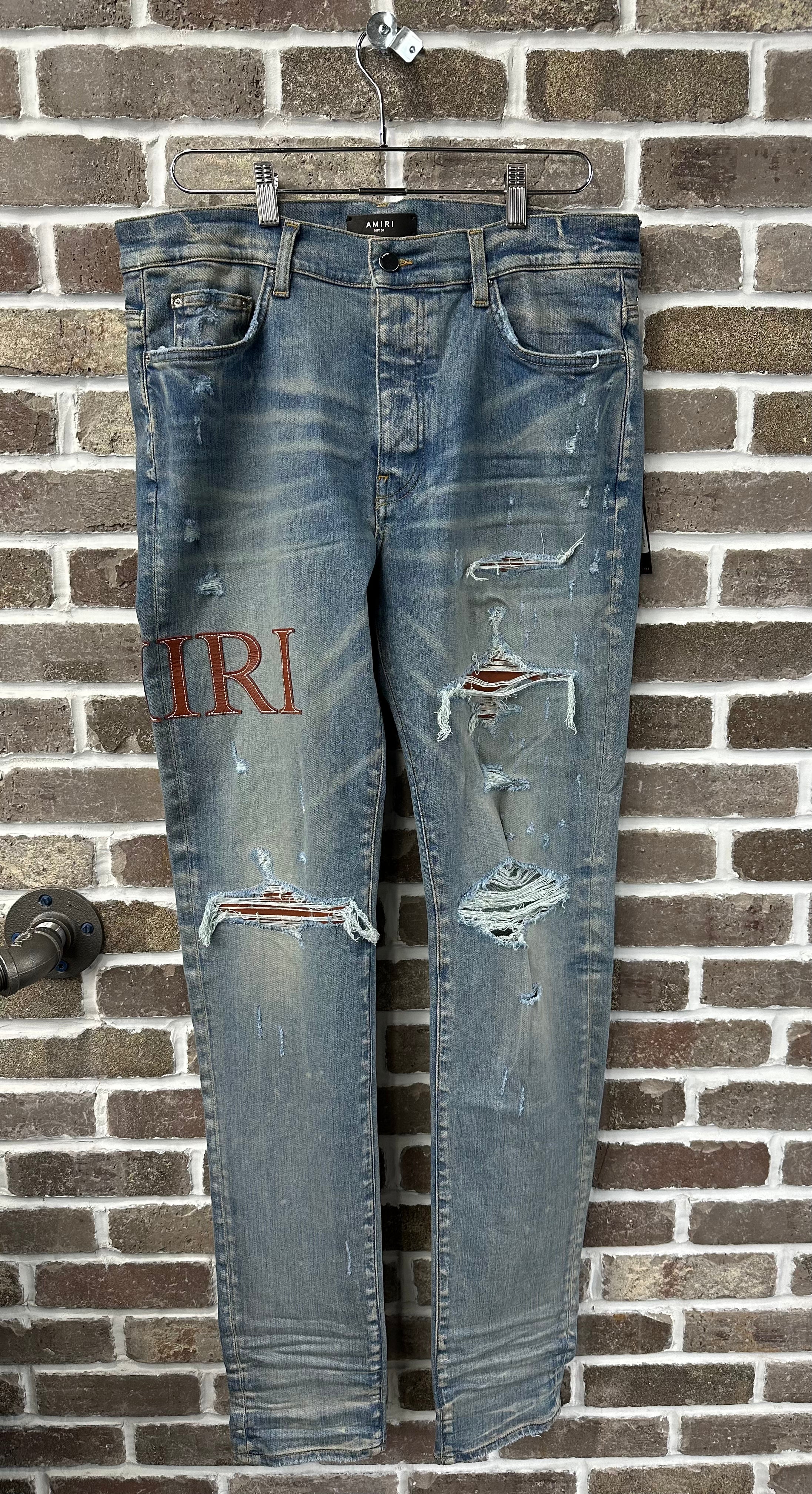 Amiri MX1 Brown Logo Patch Jeans