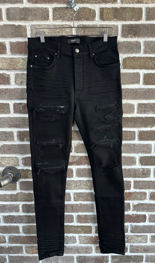 Amiri Black Patch Thrasher Jeans