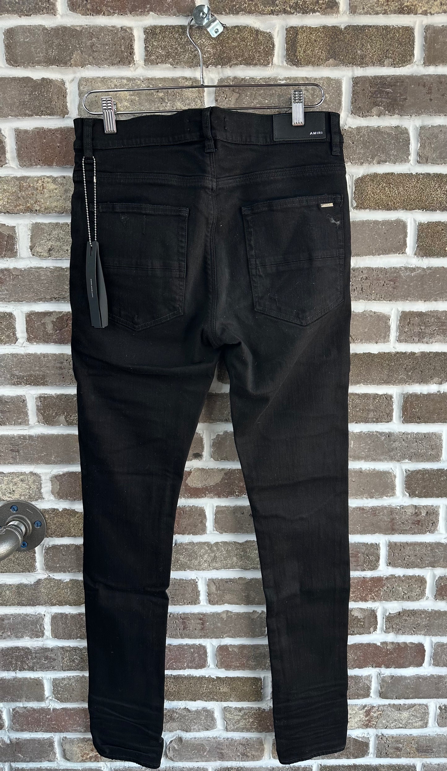 Amiri Black Patch Thrasher Jeans