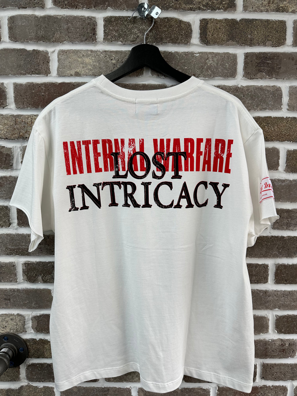 Lost Intricacy Front Page Mag Tee